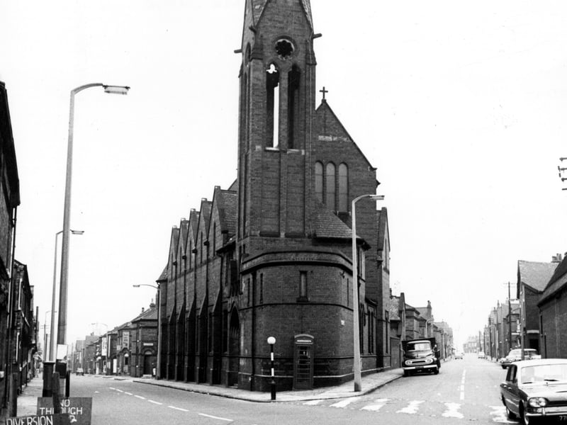 Church of the Holy Name on Cambridge Road. This church is at the junction of Cambridge Road (to the left) and Servia Road (to the right) at the end of Woodhouse Street. It was designed by Chorley and Cannon, built in 1881, at a cost of £4000. There was seating for 450, with a schoolroom for 700 children. It fell into disuse as a church and became a furniture store for the Education Department.