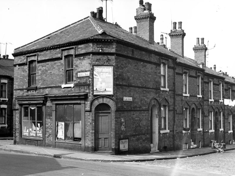 Servia Road, the shop on the left, number 11 had been a bakers. In this view is selling second hand goods. At the junction with Claro Avenue, number 13 is empty. The houses on Claro Avenue descended in number from 16 to 10.