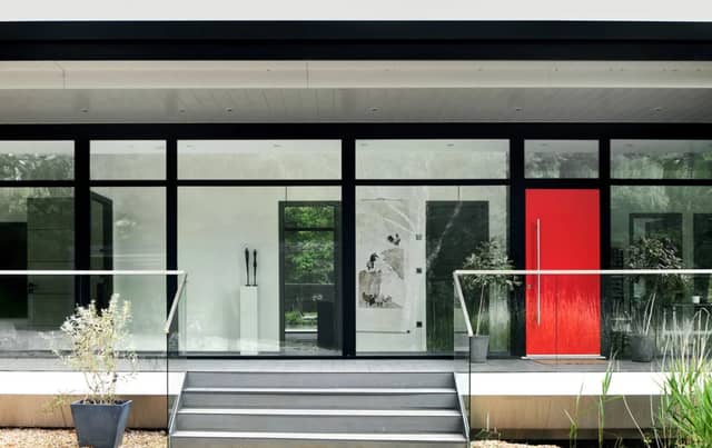 The listing says: "This superb five-bedroom, eco lake house bridges 4,000 sq ft of lateral space between two islands. The only one of its kind in the UK, the house was built to the designs of Peter Huf and completed in 2021."