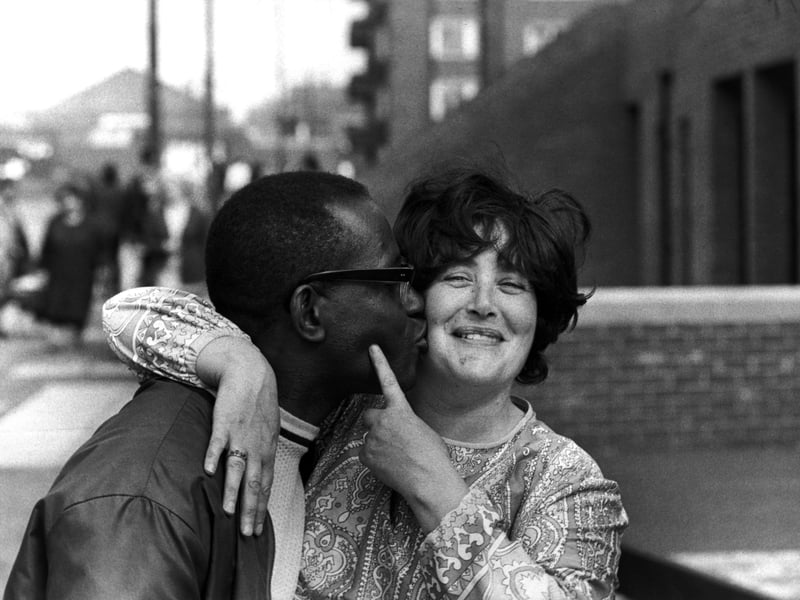 A man kissing a woman on the cheek in Liverpool, 1972.