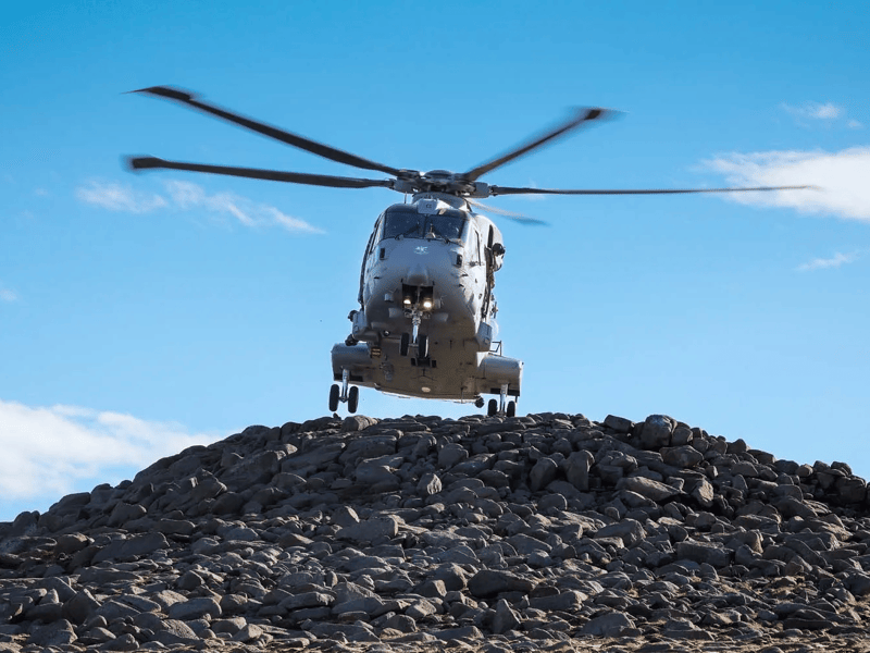 A Merlin Mk 4 helicopter conducting Air Live Firing Tactical training.