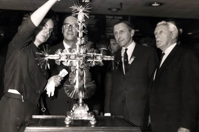 The 1966 blade for the Joseph Rodgers Year Knife is unveiled by Sylvia Kaiser on July 10 that year. The knife was made in 1821 by Sheffield cutlers Joseph Rodgers & Sons, with one blade for every year to that date, with more added over the years. The knife was bought in 1969 by Stanley Tools (UK) with a final 2,000th silver blade added in the year 2000, when it was renamed the Millennium Year Knife.