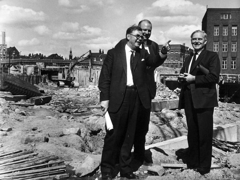Tom Fraser, right, Minister of Transport is shown features of the Leeds Inner Ring Road under construction by Mr. C.G. Thirlwall, Leeds City Engineer and planning officer, left, when he visited the site in August 1965. Also in the photo is Mr. A. T. B. Shand, chairman of the contractors.