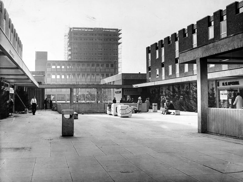 The upper precinct of the Seacroft Centre with, in the background, a 17 storey block of flats. Pictured in October 1965.