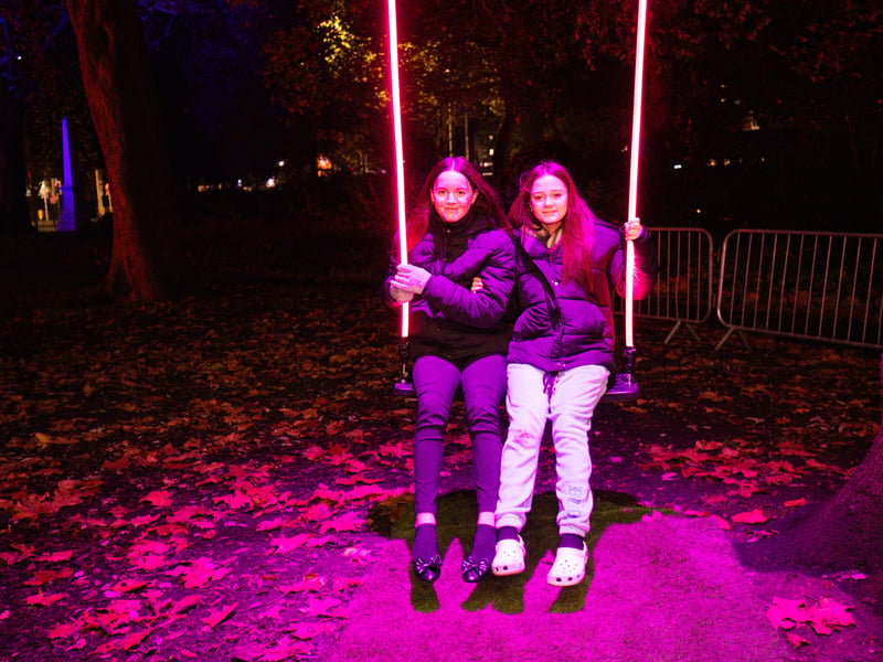 Tala and Maisie on the big illuminated swing at Victoria Park. Picture: Marcin Jedrysiak