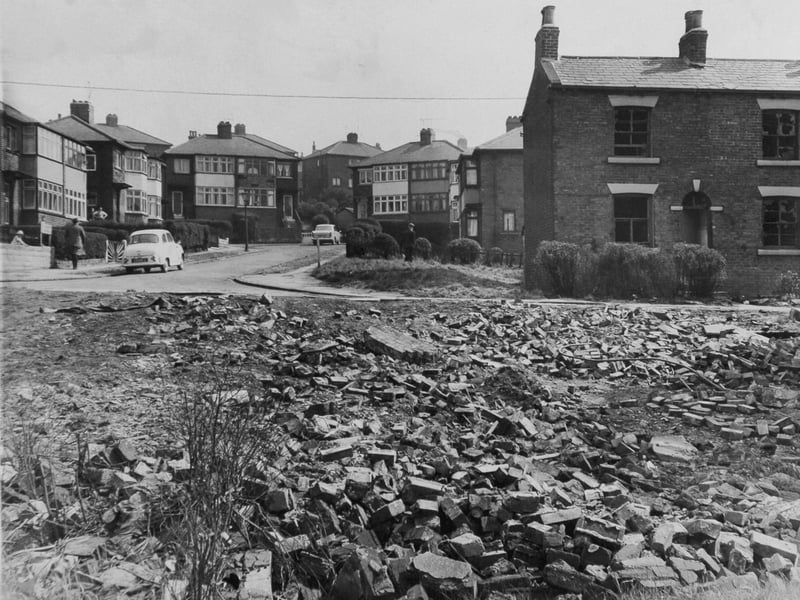 Rubble adjoining a garage and derelict property alongside the trim houses in Baron Close. A local resident threatened legal action in letters to the city's Public Health Department and the Town Clerk alleging that the Corporation was responsible for derelict property adjoining and near his home. Pictured in April 1965.