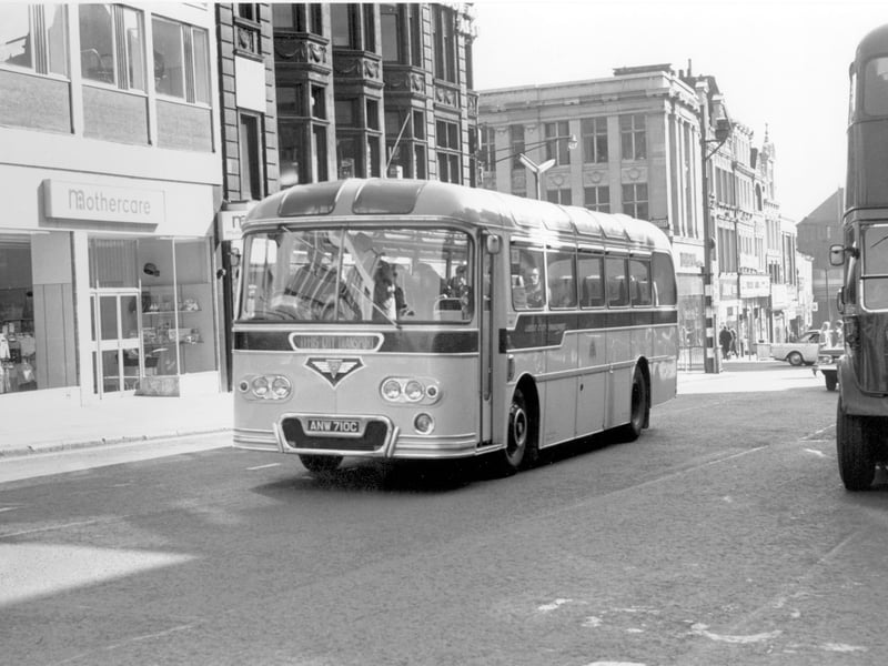 A single deck bus, an AEC Reliance 470/Roe 10 taken in September 1965. Registration no ANW 710C, no destination is displayed, logo Leeds City Transport. This is Briggate, just behind the bus on the left is the Junction with Duncan Street.