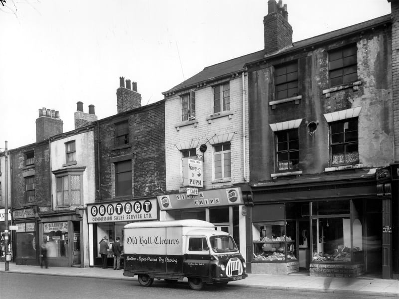 North Street in October 1962. On the left, Modern Floorcovering Company offering tufted carpets is at number 202. Moving right, S. Lewis, gents hairdressers is 200. 'Contact' second hand goods are number 198, then the Oxford Cafe, fish and chip shop is 196. Joseph Drogie has a greengrocers at 194. Van for Old Hall dry cleaners in view.