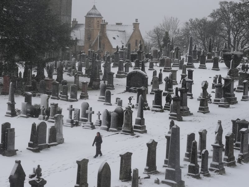 A walker cuts through the snow at the Church of the Holy Rude in Stirling.