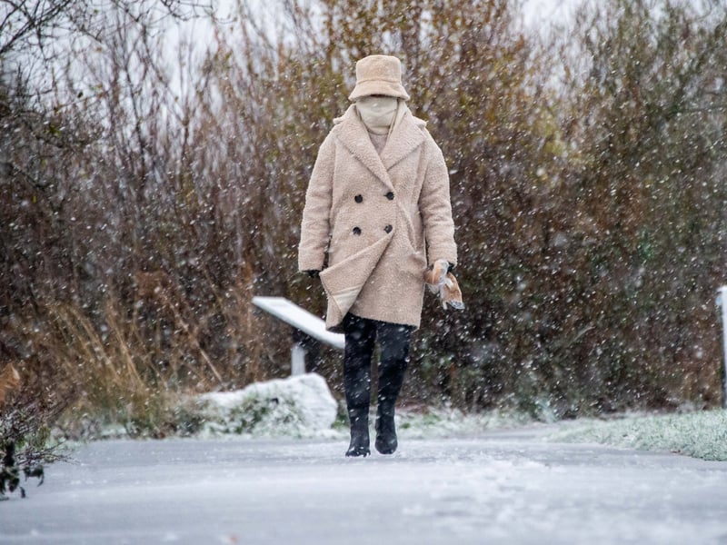 A woman braves Storm Bert at Drumpellier Country Park, Coatbridge. PIC: Lisa Ferguson.