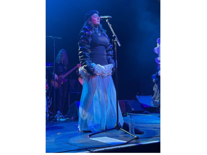 The third member of Say She She onstage in Glasgow - Piya Malik.
