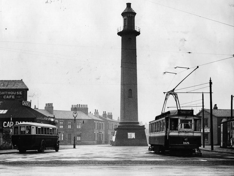 10th May 1934:  The Fleetwood Light, tall and prominent as a lighthouse, located in the heart of Fleetwood, Lancs.  A tram and bus pass by