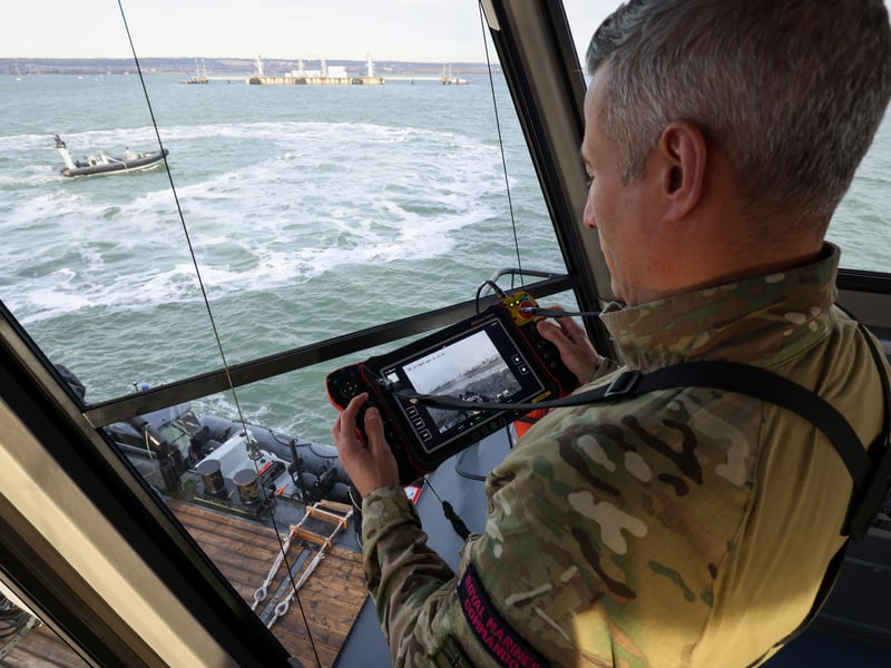 An un-crewed Pacific 24 rigid inflatable boat was remotely controlled from Royal Navy experimentation ship XV Patrick Blackett while the pair sailed off the coast of Portsmouth.