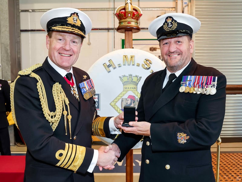 First Sea Lord, Admiral Sir Ben Key presents WO1 Les ‘Robbie’ Robertson with his Third Clasp 3rd Bars in recognition of over 45 years distinguished service.