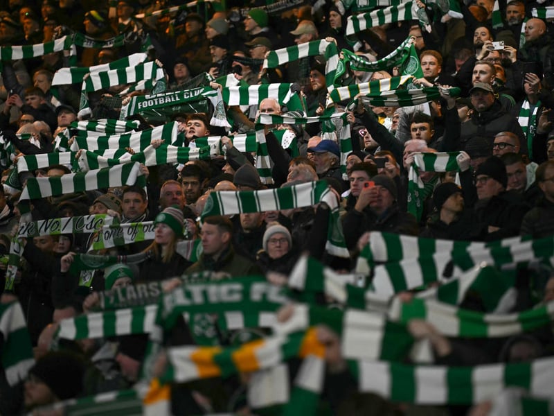 The Celtic fans roar on their team on a cold night in Glasgow.