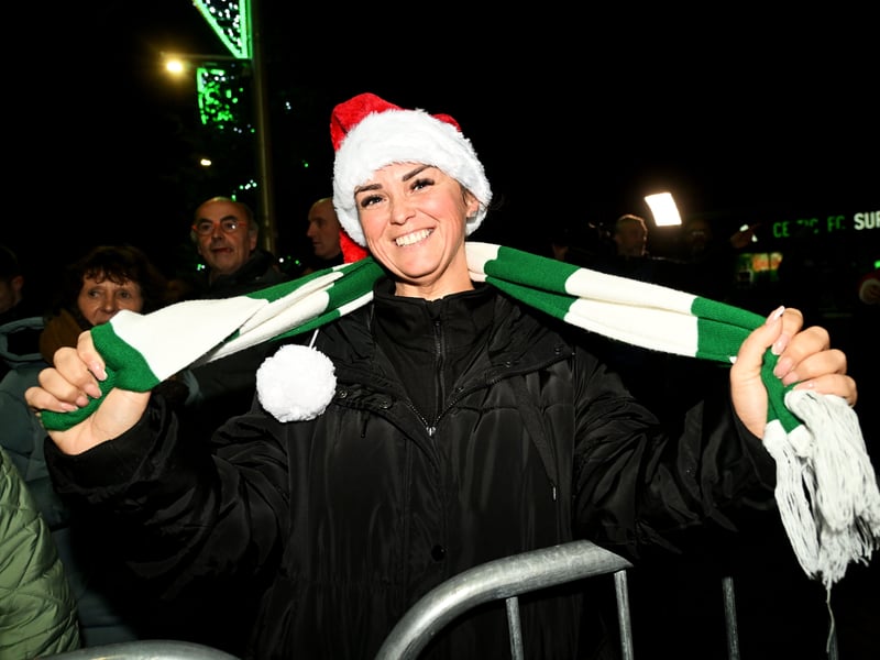 A Celtic fan pre-match dons a Santa hat pre-match.