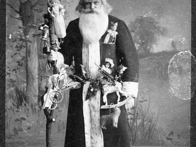 A Mr Henry Watson rose to the Christmas occasion and dressed up as Santa for a party in Burntisland in December 1909. PIC: National Museums Scotland.