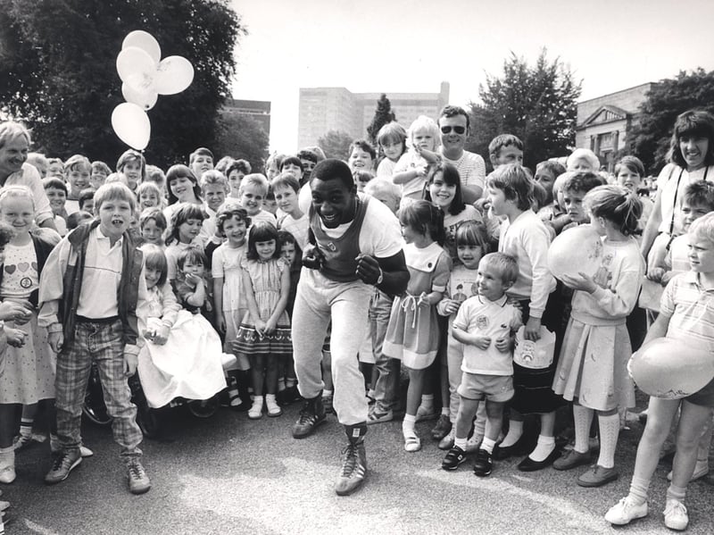 Boxer Herol Graham pictured with children during the Sheffield Spectacular in 1987
