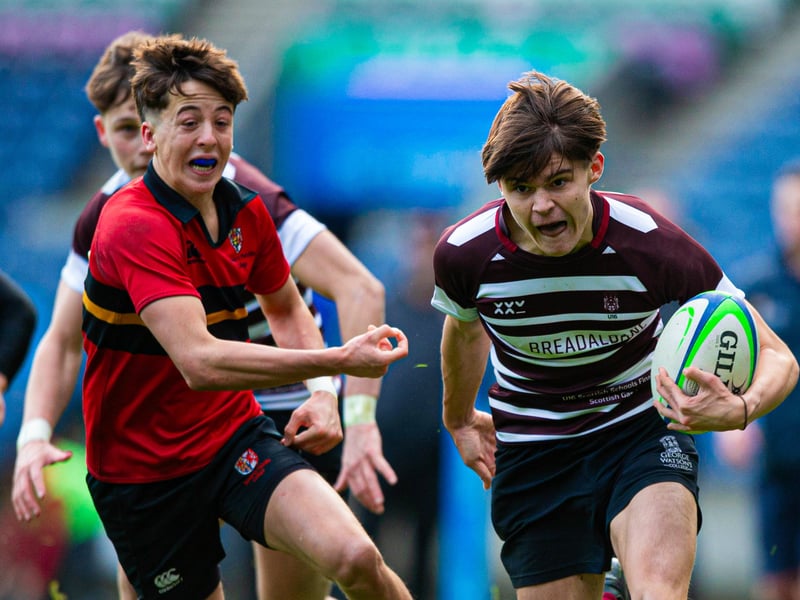 Match action between Stewart's Melville (red) and George Watson's during the Under-16 final at Murrayfield.