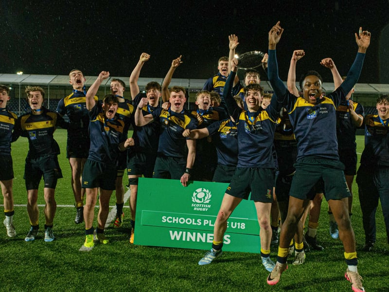 Robert Gordon's College players celebrate at full time with the trophy and winners board after victory over Glenalmond College in the Under-18 plate final.