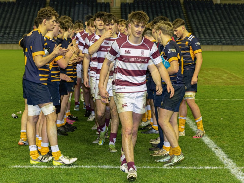 George Watson's College players are applauded by High School of Dundee after their victory in the Under-18 shield final.