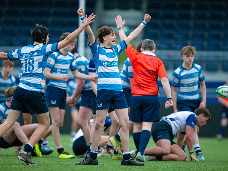Edinburgh Academy players celebrate at full time after defeating Dollar Academy in the Under-16 shield final.