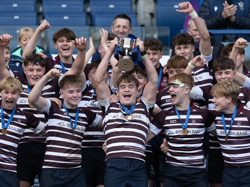 George Watson's players lift the trophy at full time after defeating Stewart's Melville in the Under-16 final at Murrayfield.