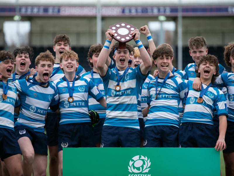 Edinburgh Academy players celebrate victory over Dollar Academy in the Under-16 shield final.