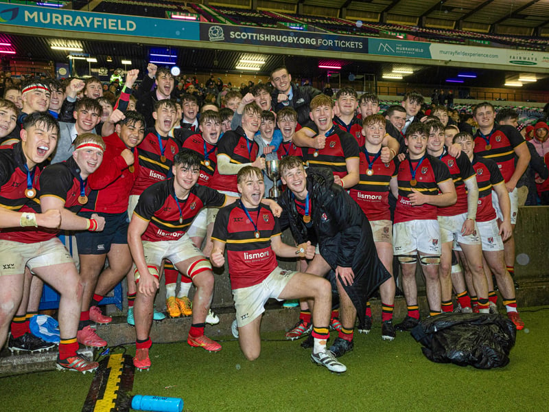 Stewart's Melville College players celebrate at full time after victory in the Under-18 Schools Cup final.