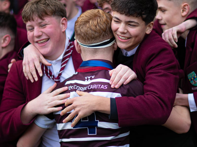 A George Watson's player celebrates with fans at full time after victory over Stewart's Meville in the Under-16 final.