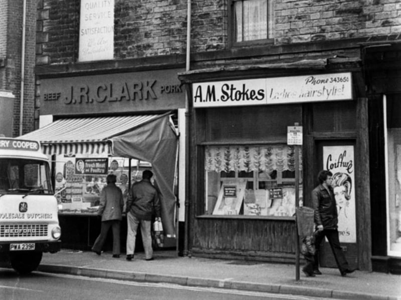 Holme Lane, Hillsborough, in November 1981, showing 	J. R. Clark, pork butcher; and A. M. Stokes, ladies hairdresser