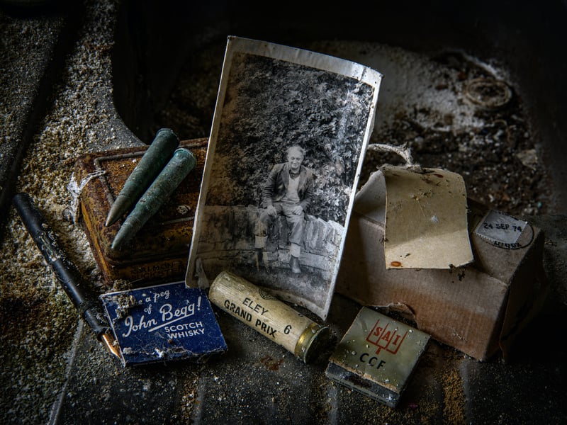 A forgotten photograph, matches, bullets and a shotgun cartridge left behind at an abandoned crofthouse at Benacheilt in Caithness. Photographer Angus Mackay said finding the image put the "hairs up on the back of my neck".