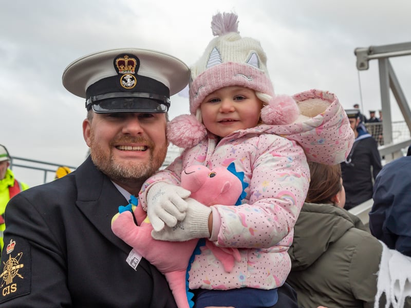 Petty Officer Gary Russell (35) with his daughter Rosie (3). HMS Duncan conducted a Christmas homecoming from the Mediterranean in December 2024.