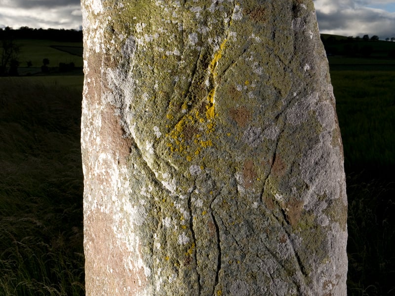 Part of the The Collessie Standing Stone. It lies a few miles from the site where the stone tools and charcoal deposits were discovered in Harris. The stone may have had practical or ceremonial uses and would have existed at the same time as the people who started these fires and created these tools.