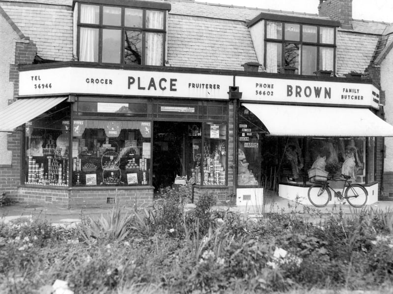 Two shops on Otley Road, between Holt Lane and Farrar Lane at number 469 Owner Place. Next door number 471 butchers shop, owner Charles Brown. The window display includes two ceramic pigs advertising bacon. A delivery bike with basket is against the window. Pictured in 