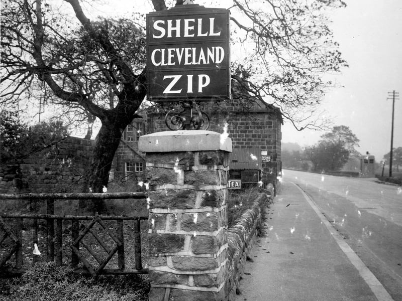 The entrance to a petrol station on Otley Road, the business of Sydney Haithwaite and John Edward Britten. A garage sign for fuel 'Shell, Cleveland, Zip' can be seen.  Pictured in October 1932.