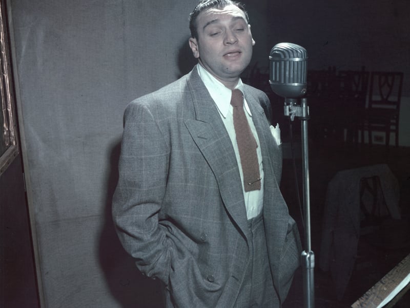 Frankie Laine's classic ballad "I Believe" holds the record for the longest consecutive reign at the top of the UK Singles Chart, with an astonishing 18 weeks at Number 1 in 1953. His success was not a single stint, though—it saw three separate runs at the top, one of which stretched to an impressive nine weeks straight.