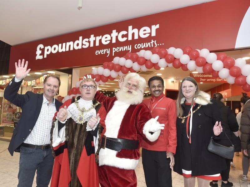 Pictured is: (l-r) Andy Newton, property director for Poundstretcher, Lord Mayor of Portsmouth Jason Fazackarley, Father Christmas, Satheesh Kumar, store manager and Lady Mayoress of Portsmouth Helen Mitchell. Picture: Sarah Standing (121224-7643)