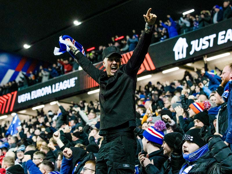 A Rangers fan celebrates the opening goal