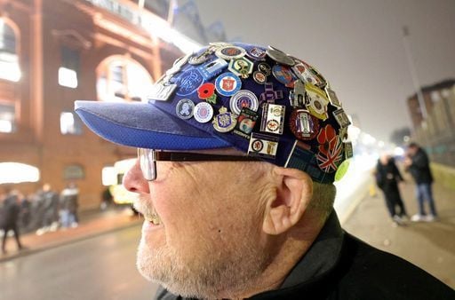 A Rangers fan with a cap covered in pin badges outside the ground before the during the UEFA Europa League clash.