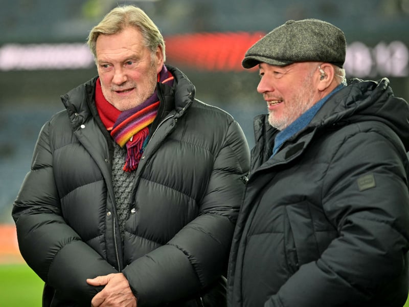 Former Tottenham Hotspur and England footballer Glen Hoddle (L) and former Rangers and Scotland footballer Ally McCoist speak before the game.
