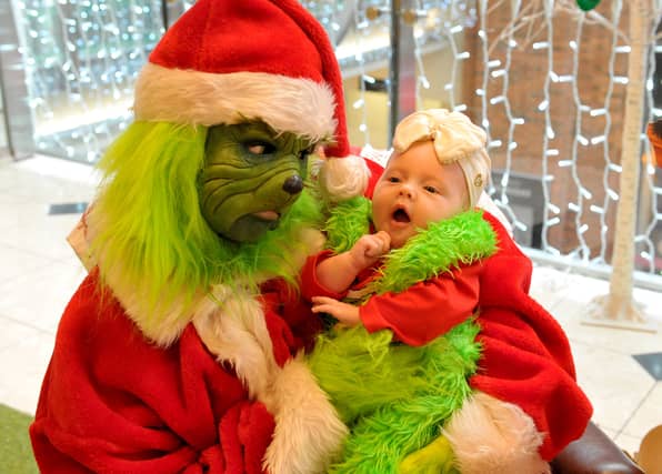 Two-month-old Minnie McCulloch from Middleton says hello to the Christmas Grouch.
