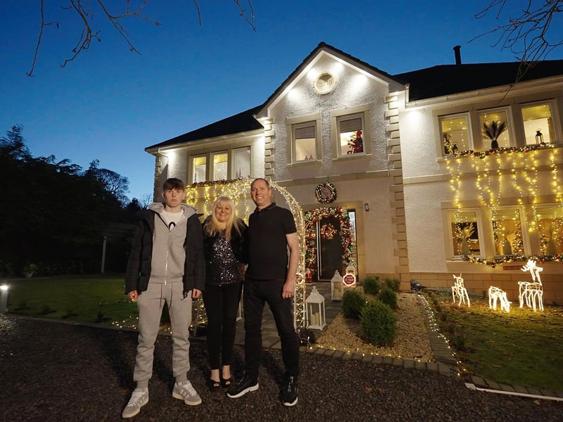 Scotland's Christmas Home of the Year - Homeowners Gillian and Philip with their son Mackenzie outside Mistletoe House, Cumbernauld