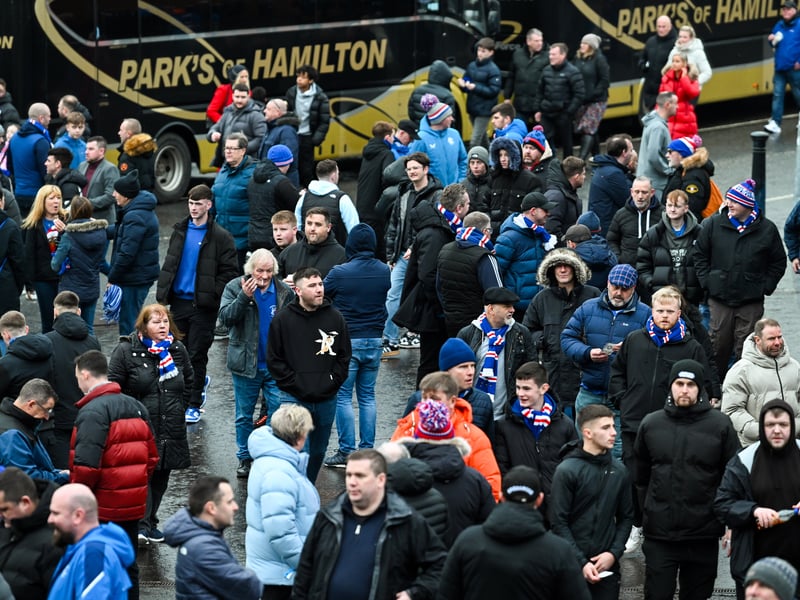 Rangers fans get ready to enter Hampden Park ahead of the game.