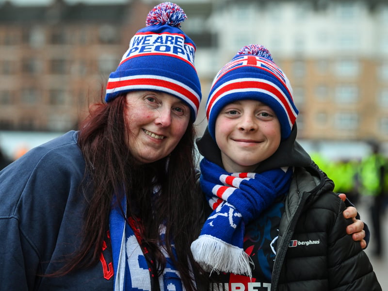 Two Rangers fans prepare for the game.