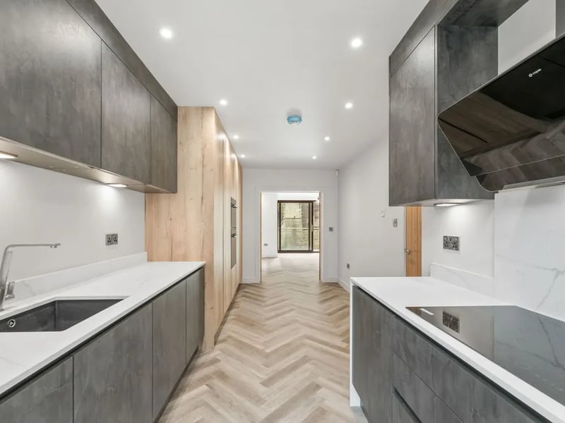 Carefully placed windows flood the home with light and will give the news owners a view to the gorgeous cemetery behind no matter where they stand.