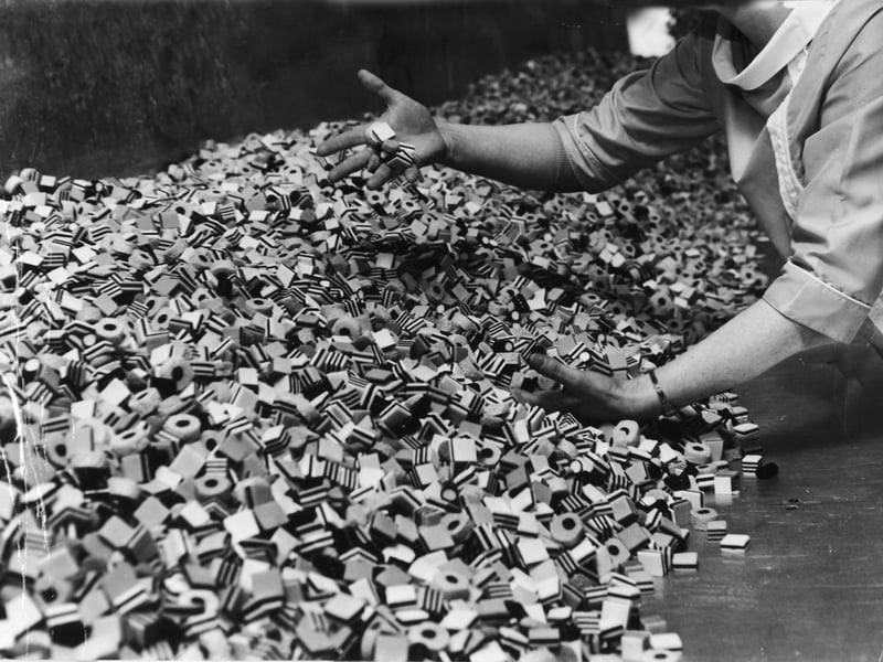 "All Sorts" thousands of them, part of a 75,000lbs order for Canada, and with them Mrs. Vaus, quality controller at the factory in February 1969.