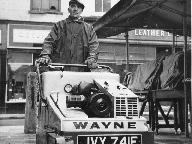 One of York's four street-sweeping machines is driven by Edward Moloney in February 1969.. The city could use more of these machines but cannot find the staff to operate them.