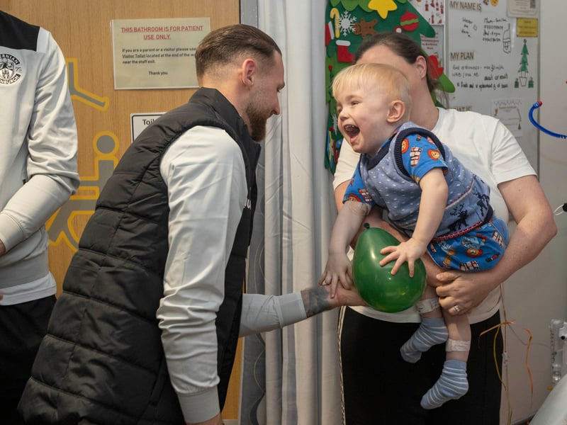 Pure joy. Martin Boyle makes this young fan's day as players spend time with patients.