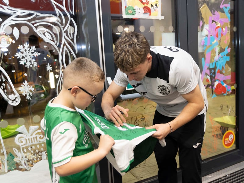 Hibs players - including Rudi Molotnikov, pictured - spent time signing autographs for young fans.